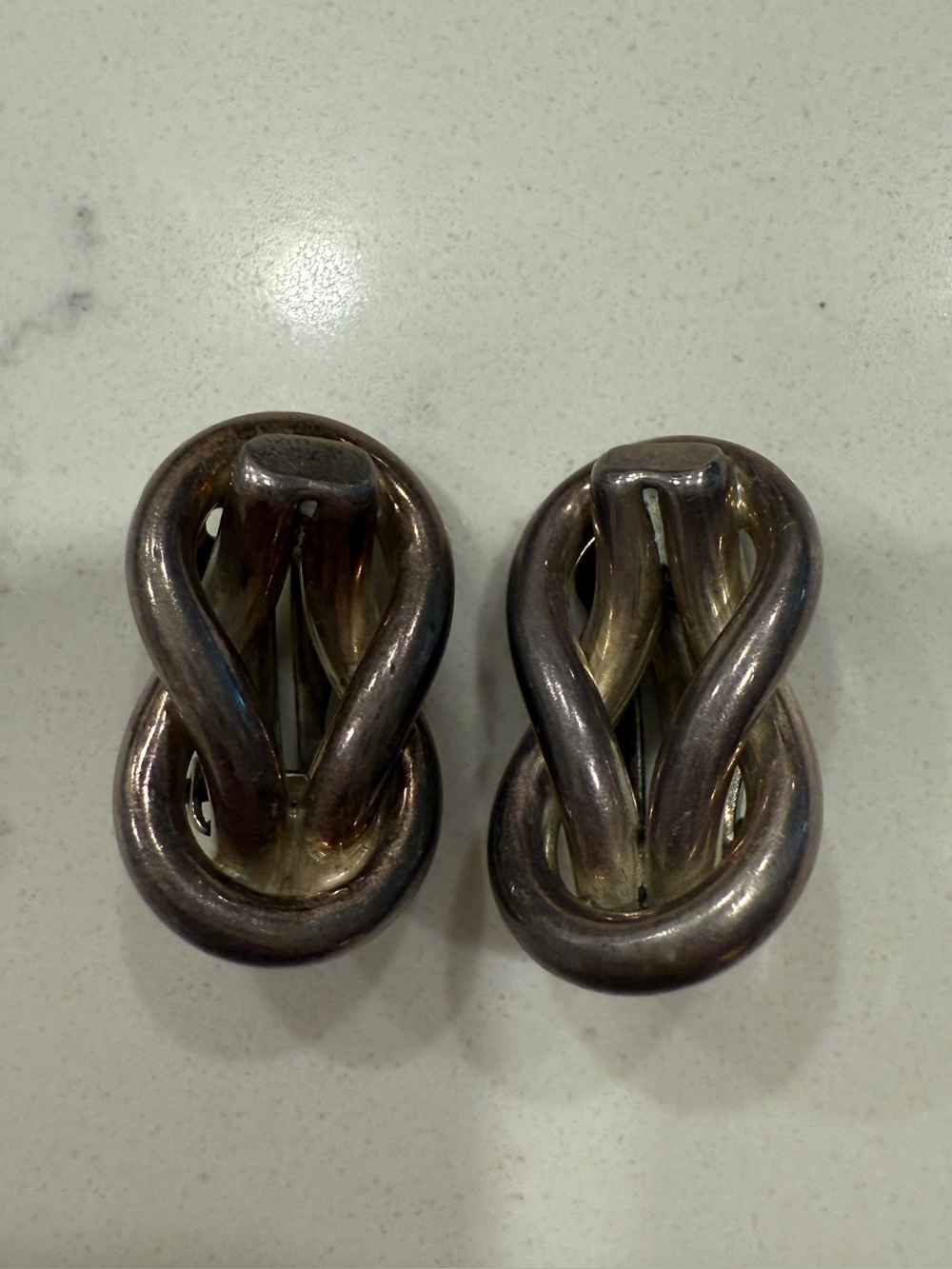 Twisted Knot Clip On Earrings - Silver Tone
